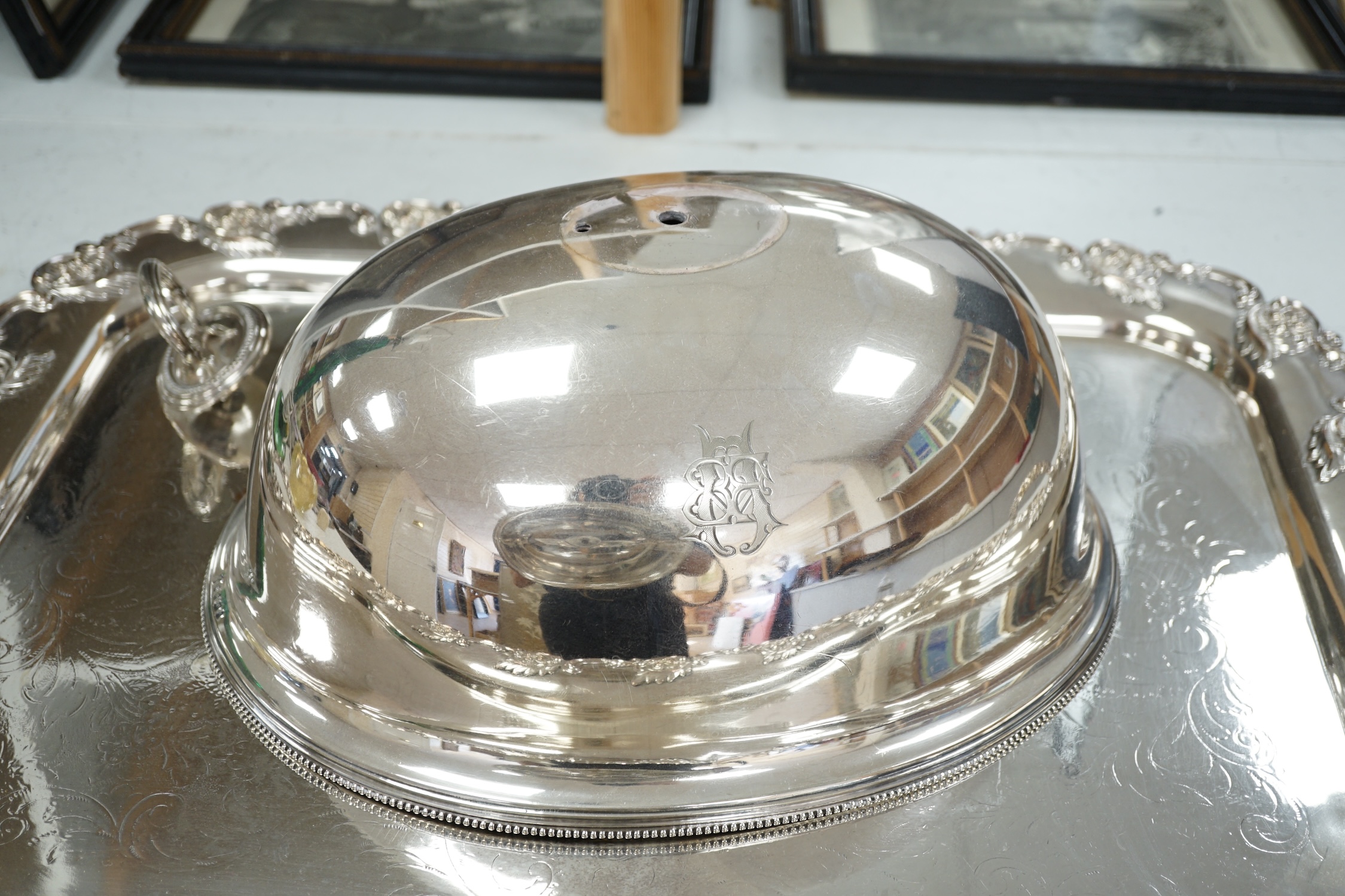 A pair of Victorian electroplate meat domes and a large two handled tray, tray 76cm wide including handles. Condition - good